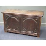 A large oak coffer 76 x 136 x 59cm