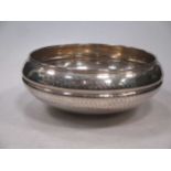 A silver plated hammered finished bowl, signed to the base 'Christian Dior', together with a cased