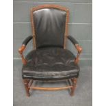 A continental Louis XVI style elbow chair in black cloth cover
