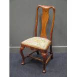 A Queen Anne style walnut dining chair, with vase shaped splat and cabriole front legs connected