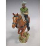 A Beswick model of a cowboy, 23cm high