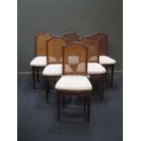 A set of 7 Continental caned dining chairs, one with arms, together with a Louis VX painted cane