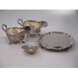 A silver waiter 11.8ozt, together with a pair of silver plated sauce boats and a silver plated tea