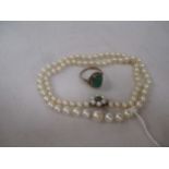 A row of cultured pearls together with a 9ct dress ring