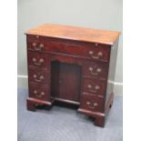 Attributed to Gillows of Lancaster, a George III mahogany kneehole writing desk, the brushing