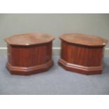 A pair of mahogany wine cooler bases by Bretts of Norwich, of octagonal form with side carrying
