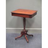 A George III mahogany single drawer lamp table with tapering bobbin turned column and brass