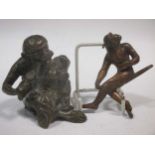 A Berman type early 20th century bronze of a monkey feeding a baby monkey with a spoon. 7cm high and