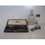 A Silver christening spoon and fork, cased. A Silver topped small glass jar. A South American 800