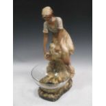 An Art-Nouveau plaster figural centrepiece, the kneeling water maid above a glass bowl, 59cm high