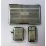 An Edward VII silver vesta by Sampson Mordan, another vesta and a pocket cigarette case,