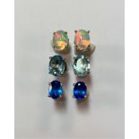 Three pairs of single stone earstuds - opal, blue topaz and blue apatite,