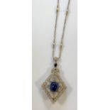 A Belle Epoque cabochon sapphire and diamond brooch / pendant and chain,