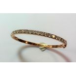 A diamond line bangle,