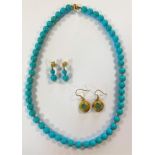 A turquoise bead necklace and matching earpendants and another pair of earpendants,