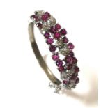 A modern ruby and diamond hinged bangle,