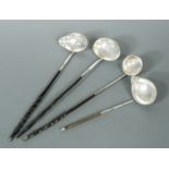 Four George III silver punch ladles,