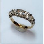 A five stone carved head style ring,