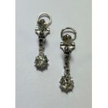 A pair of diamond set articulated earpendants,