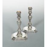 A pair of 20th Century cast silver candlesticks,