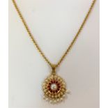 A synthetic ruby and pearl pendant and chain of Indian origin,