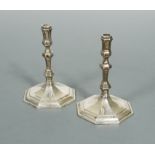 A pair of 20th Century cast silver taper sticks,
