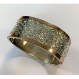 A bi - colour Victorian silver bangle,