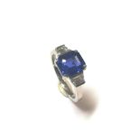 A modern sapphire and diamond three stone ring,