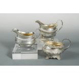 A collection of three Georgian silver cream jugs by Emes & Barnard,