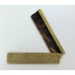 A travelling comb in a 14ct gold case,