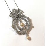 An impressive Belle Époque diamond and pearl brooch / pendant,