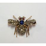 A diamond, sapphire and ruby set insect brooch,