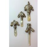 Two rare George V Scottish silver child's teething rattles and two others,