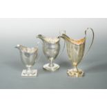 A trio of 18th Century George III silver helmet style cream jugs,