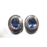 A pair of sapphire ear clips set in 18ct white gold,