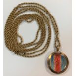 A long guard chain together with a double sided locket,