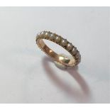 A full hoop half pearl eternity ring,