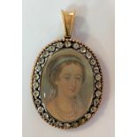 A miniature portrait of the Empress Eugénie set in a double sided pendant,