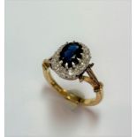 A sapphire and diamond cluster ring set in 18ct gold,