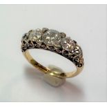 A diamond set carved head style ring,