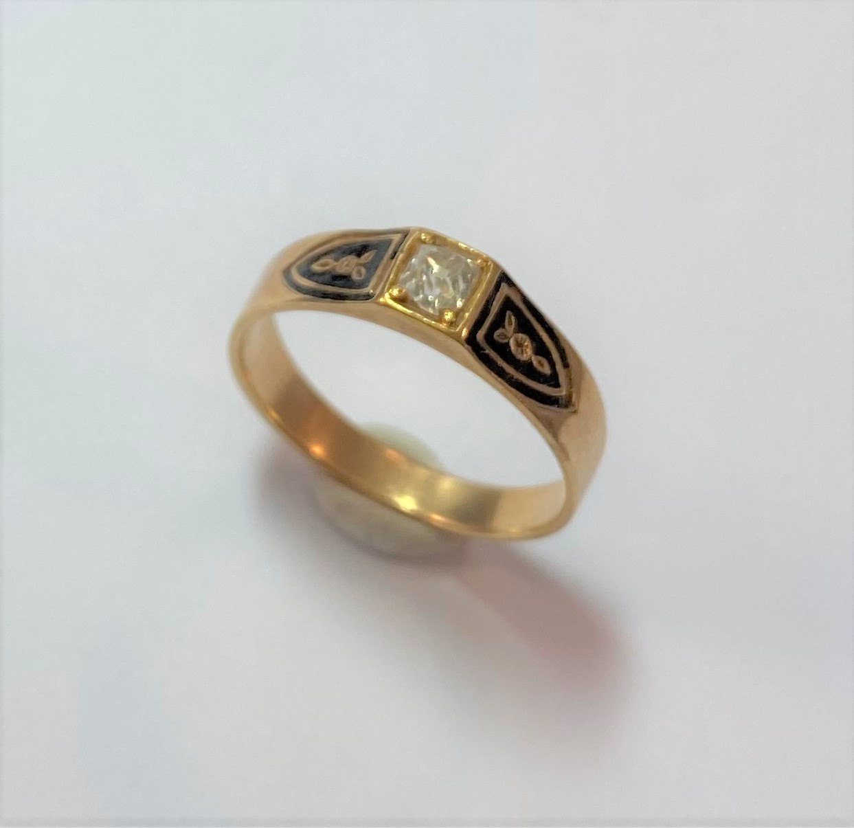 A diamond and black enamel memorial ring,