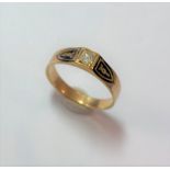 A diamond and black enamel memorial ring,