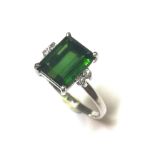 A green tourmaline and diamond ring,