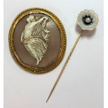 A shell cameo brooch and a banded agate and pearl set stick pin,