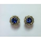 A pair of sapphire and diamond cluster earstuds,