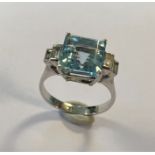 An aquamarine and diamond ring,