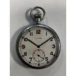 Cyma – A base metal military issue open-faced pocket watch,