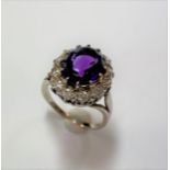 An amethyst and diamond oval cluster ring,