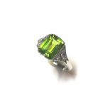 A peridot and diamond ring,