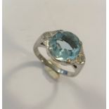 An aquamarine and diamond ring,